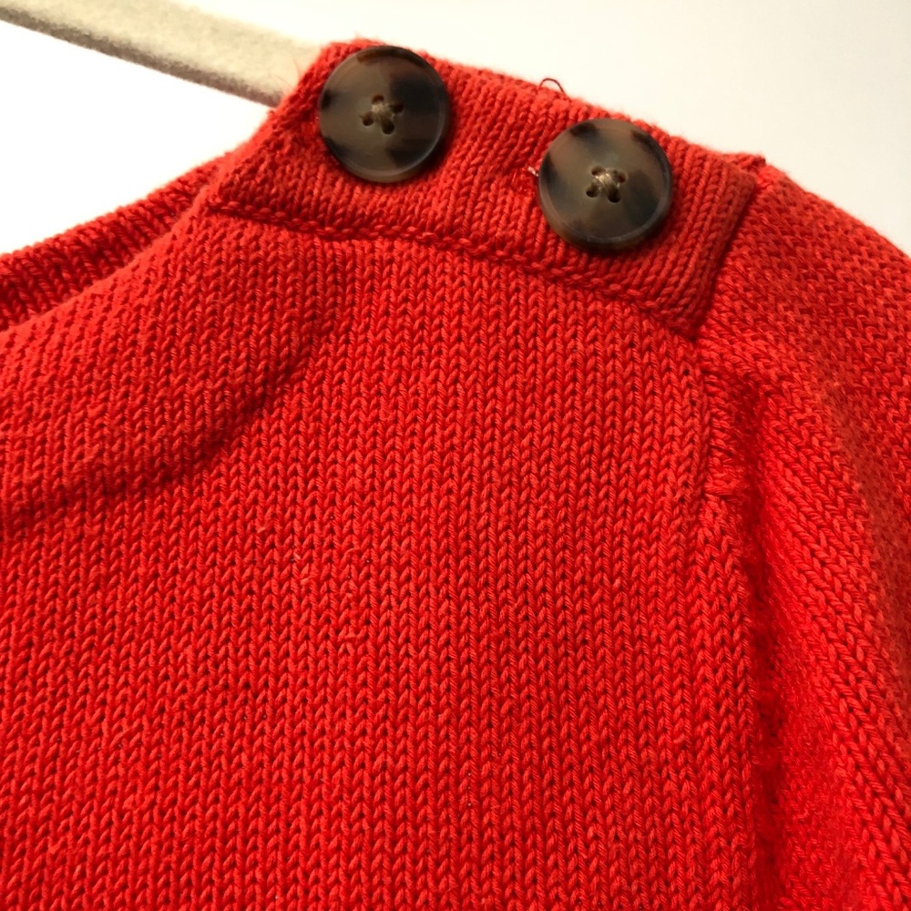 Orange sweater with button detail